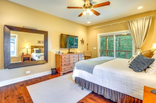 a bedroom with a bed and a large mirror at Rustic Retreat in Cadiz On Lake Barkley in Cadiz
