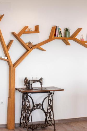 a wooden table with a shelf on a wall at Apartman Spin in Kastav