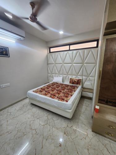 a bedroom with a bed in a room at EL Dorado 11 in Indore
