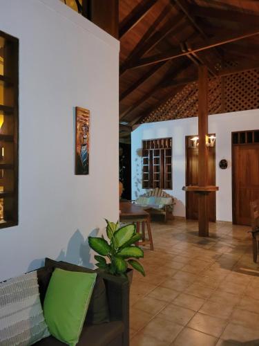 a living room with a couch and a table at Osos Caribeños - with Garden - 400m from the Beach in Punta Uva