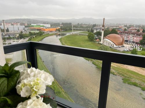 a balcony with a view of a river at شقة نهر اليجا in Sarajevo