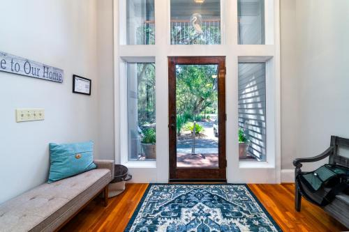 a living room with a couch and a door at 2873 Hidden Oak Drive in Seabrook Island