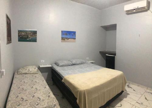 מיטה או מיטות בחדר ב-NOVO HOTEL SOURE