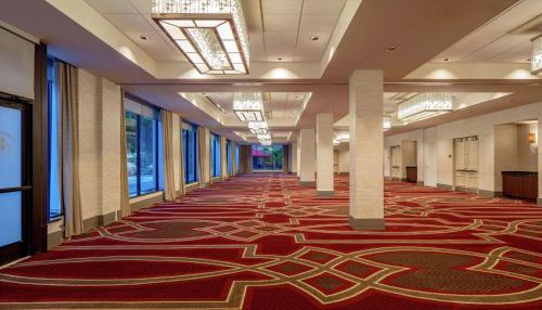 a hallway with a carpet with a maze on it at Hilton Richmond Downtown in Richmond
