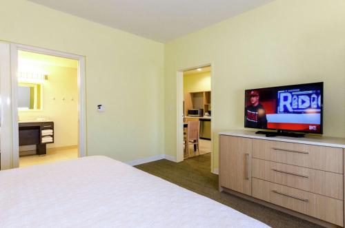 a bedroom with a bed and a flat screen tv at Home2 Suites by Hilton Portland in Portland