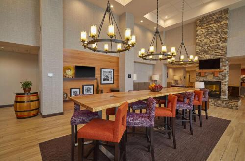 a large dining room with a large table and chairs at Hampton Inn & Suites Roseburg in Roseburg