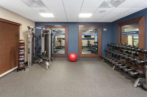 a gym with tread machines and a red ball at Hampton Inn & Suites Rocky Hill - Hartford South in Rocky Hill