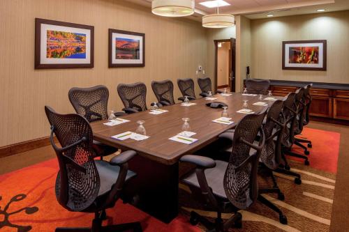 a large conference room with a long table and chairs at Hilton Garden Inn Uniontown in Uniontown