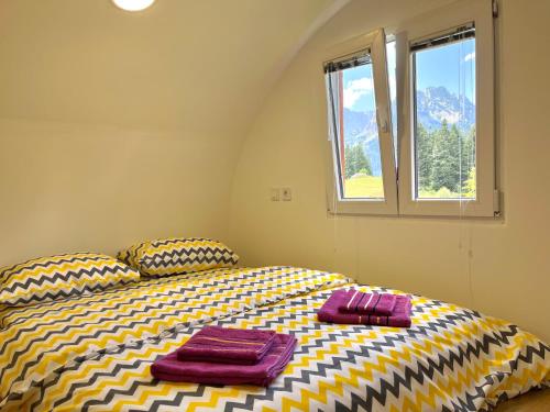 Postel nebo postele na pokoji v ubytování Bungalows Fairy tale