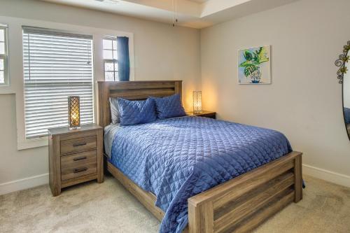 a bedroom with a large bed and a window at Parkville Vacation Rental Near Creekside Complex! in Lansing