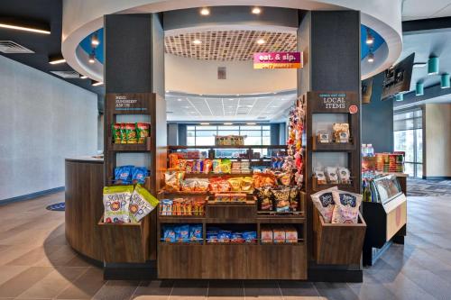 a grocery store with a display of food at Tru By Hilton St. Petersburg Downtown Central Ave in St Petersburg