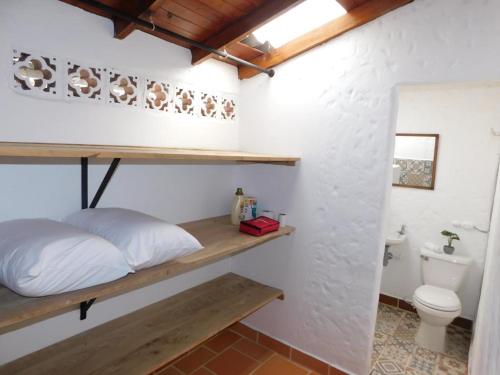 Giường trong phòng chung tại Casa campestre Jumaluna