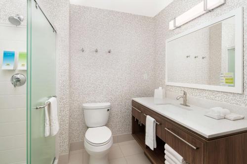 a bathroom with a toilet and a sink and a shower at Home2 Suites By Hilton Batesville in Batesville