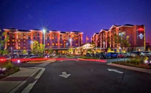 an empty parking lot in a city at night at Hilton Garden Inn Rockville - Gaithersburg in Rockville
