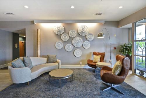 a living room with a couch and chairs at Homewood Suites Dallas-Frisco in Frisco