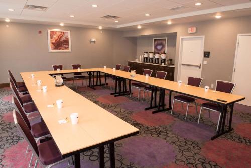 a conference room with long tables and chairs at Hampton Inn & Suites Bay City in Bay City