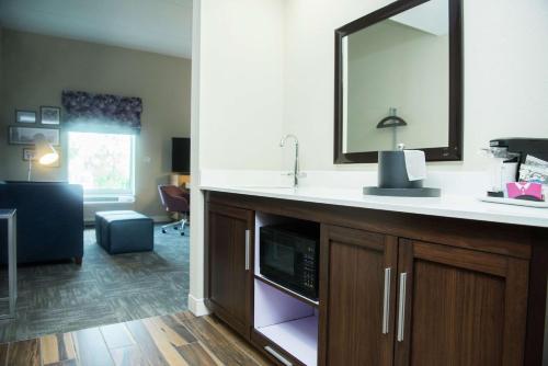 a bathroom with a sink and a mirror at Hampton Inn & Suites Warrington Horsham in Warrington