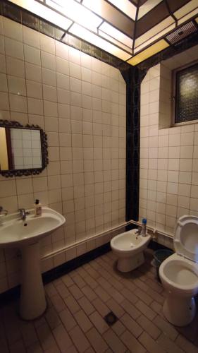a bathroom with a toilet and a sink at Гаварский уют in Gavarr