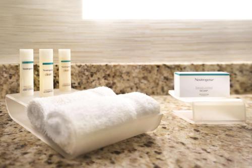 a white towel on a plate on a counter at Homewood Suites Williamsburg in Williamsburg