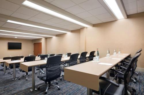 a conference room with rows of tables and chairs at Embassy Suites San Antonio Airport in San Antonio