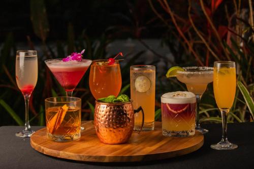 a group of different types of drinks on a table at Rincon Beach Resort in Rincon