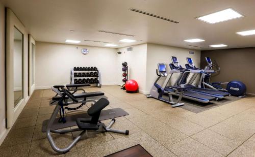 a gym with treadmills and cardio equipment in a room at Doubletree by Hilton McAllen in McAllen