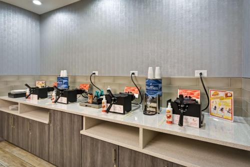 a counter with products on it in a waiting room at Homewood Suites by Hilton Orlando Theme Parks in Orlando
