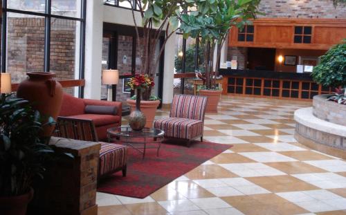 a lobby with couches and chairs in a building at DoubleTree by Hilton Hotel Oak Ridge - Knoxville in Oak Ridge