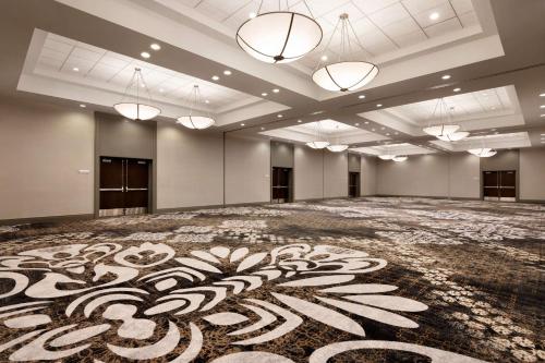 a large room with a large carpeted floor with lights at Hilton Vancouver Airport in Richmond