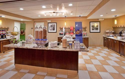 a store lobby with a counter with food on it at Hampton Inn & Suites Aberdeen in Aberdeen