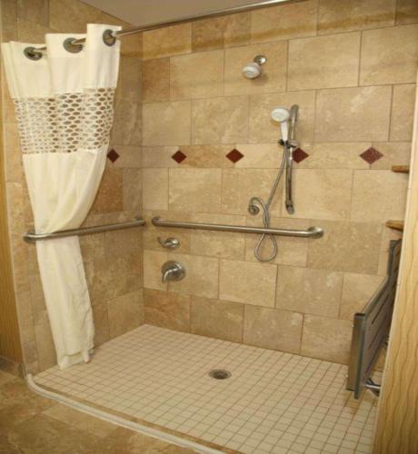 a shower with a shower curtain in a bathroom at Hampton Inn & Suites Aberdeen in Aberdeen