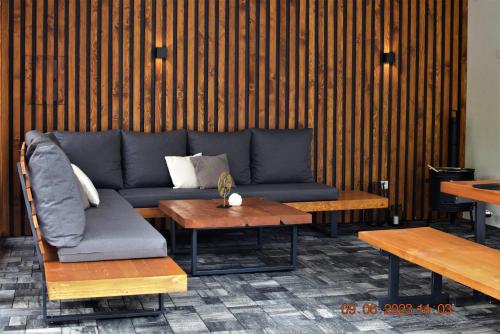 a living room with a couch and a table at Chalupa Martinček in Terchová