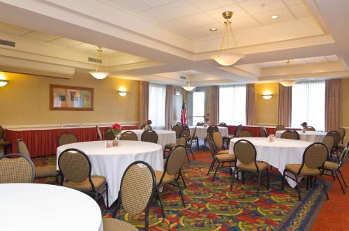 a conference room with tables and chairs in it at Hilton Garden Inn Wooster in Wooster