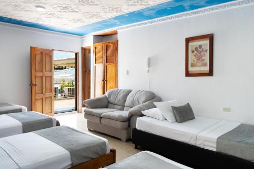 Voodi või voodid majutusasutuse Hotel Corozal Plaza toas