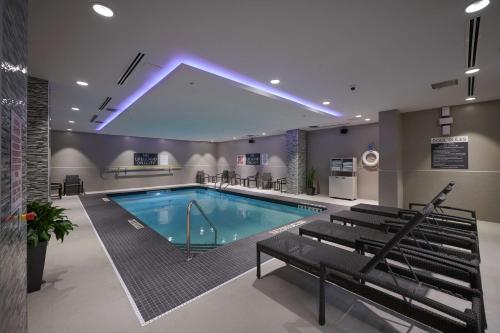 a large swimming pool in a large room with at Hilton Garden Inn St. John's Newfoundland, Canada in St. John's