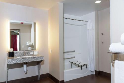 a bathroom with a sink and a shower at Homewood Suites by Hilton Columbus/Polaris in Columbus
