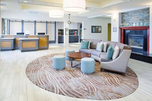 a living room with a couch and a table at Homewood Suites Lancaster in Lancaster