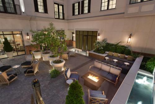 a hotel lobby with couches and a swimming pool at The Harpeth Downtown Franklin, Curio Collection by Hilton in Franklin