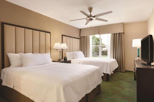 a hotel room with two beds and a ceiling fan at Homewood Suites Harrisburg-West Hershey Area in Mechanicsburg