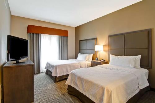 Krevet ili kreveti u jedinici u objektu Homewood Suites Houston Kingwood Parc Airport Area