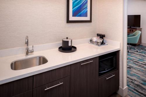 a kitchen with a sink and a counter top at Hampton Inn & Suites Olympia Lacey, Wa in Olympia