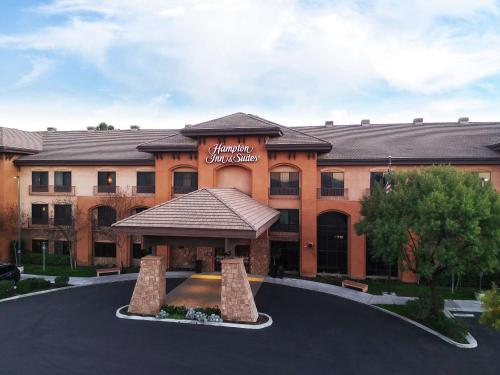 a building with a sign on the front of it at Hampton Inn & Suites Temecula in Temecula