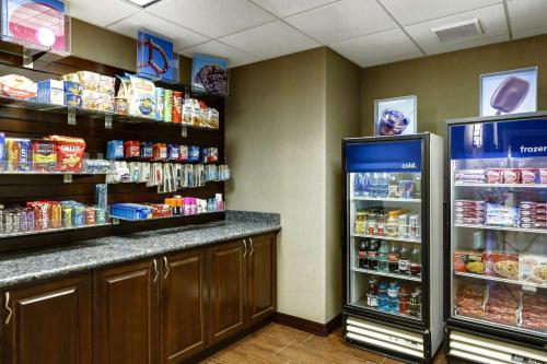 a grocery store with a refrigerator and food at Hampton Inn & Suites Temecula in Temecula
