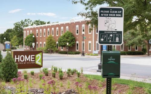 a street sign in front of a building at Home2 Suites By Hilton La Crosse in La Crosse