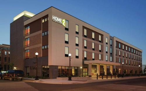 a large building with a hilton sign on it at Home2 Suites By Hilton La Crosse in La Crosse