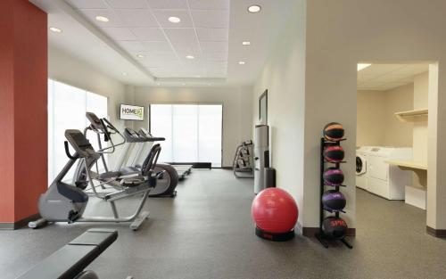 a gym with cardio machines and a red ball at Home2 Suites By Hilton La Crosse in La Crosse