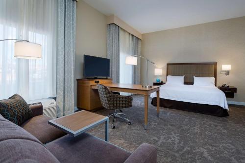 a hotel room with a bed and a desk at Hampton Inn & Suites Page - Lake Powell in Page