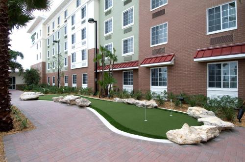a golf course in front of a building at Homewood Suites Port Saint Lucie-Tradition in Port Saint Lucie