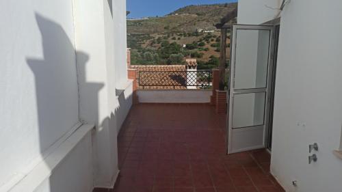 a view from the hallway of a house with a balcony at El Picacho de Ítrabo Ático in Ítrabo