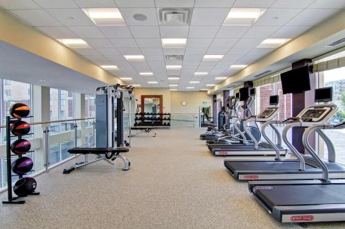 a gym with cardio equipment and treadmills at Homewood Suites By Hilton Ottawa Kanata in Ottawa